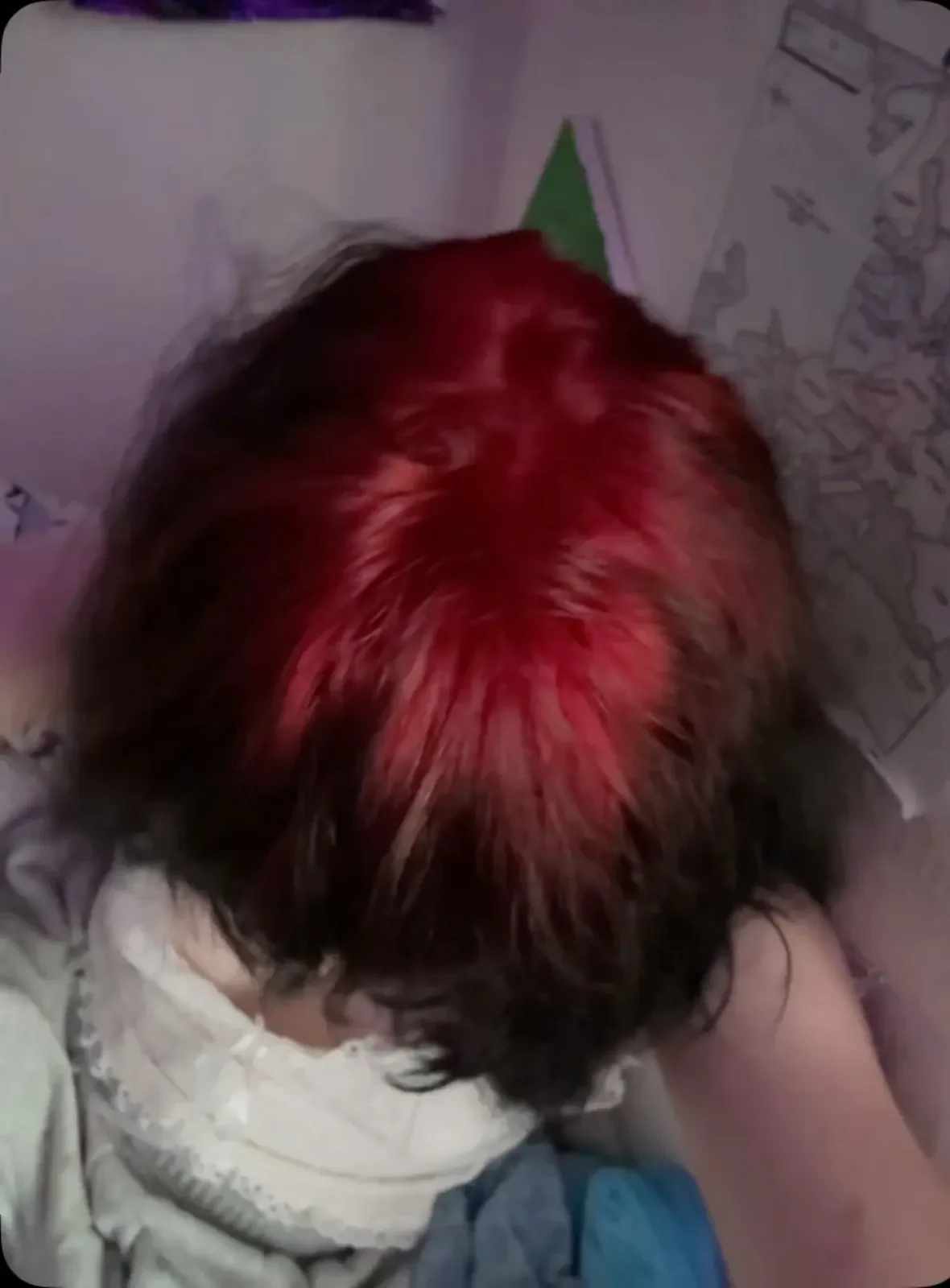 Top view of a short brown crop with deep burgundy-red color covering the central crown and darker hair around its edge.