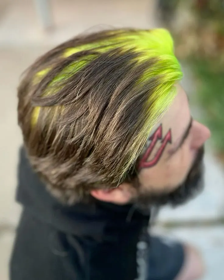 ash brown men's side-swept medium cut with neon lime ghost roots.