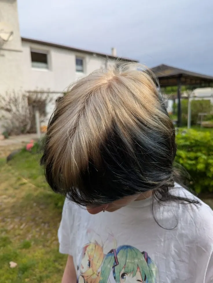 black men's curtain cut with ash blonde ghost roots.