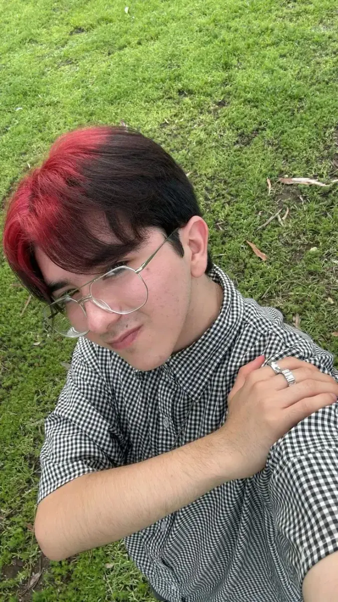 black men's short curtain cut with burgundy red ghost roots.