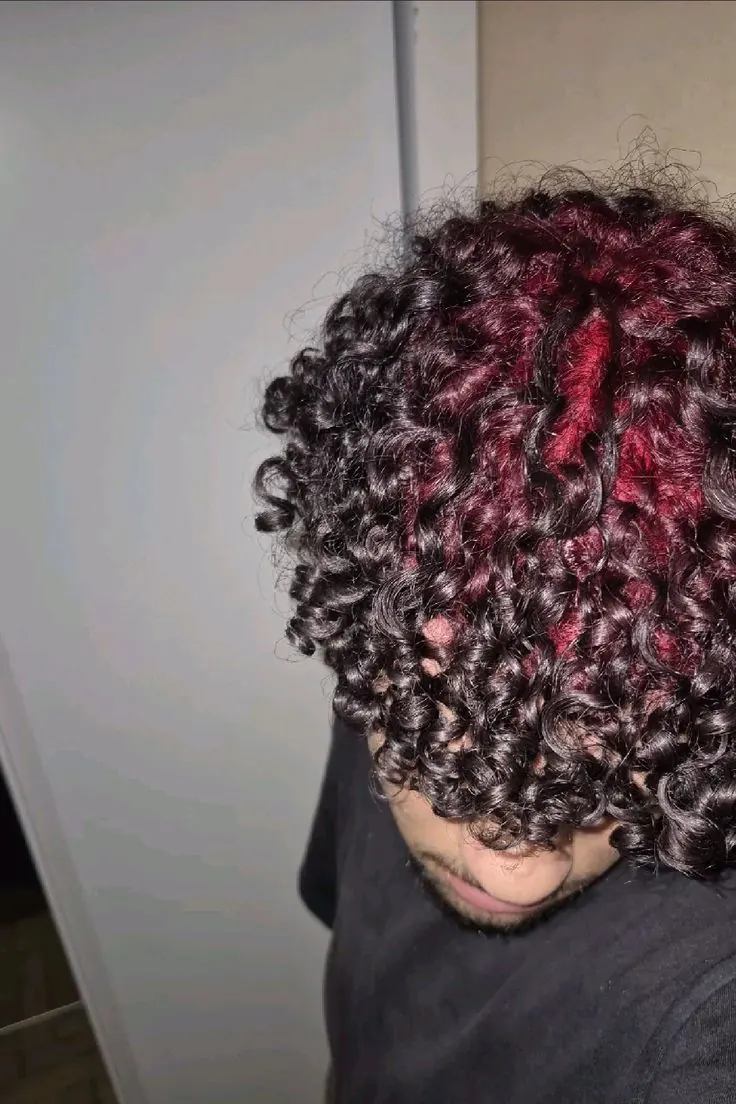black men's medium curl crop with burgundy red ghost roots.