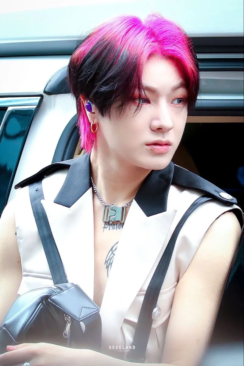 black men's layered medium cut with hot pink ghost roots.