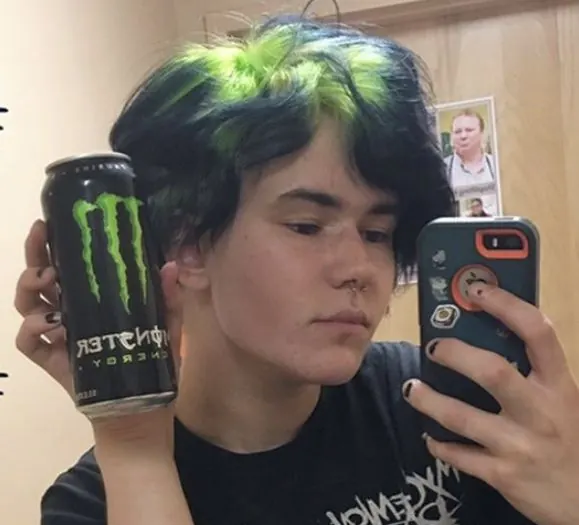 black men's short layered cut with neon green ghost roots.