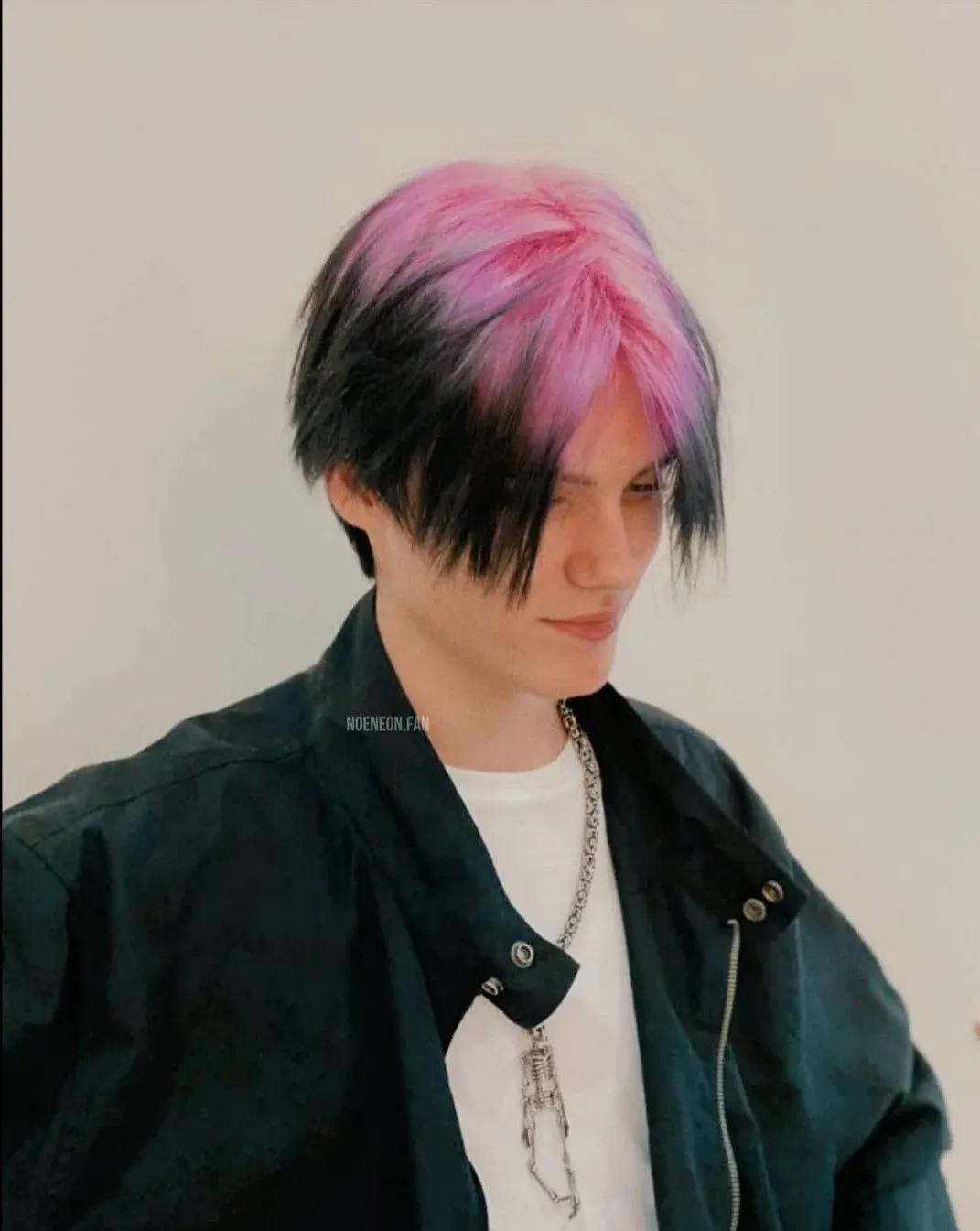 black men's layered medium cut with pastel pink ghost roots.
