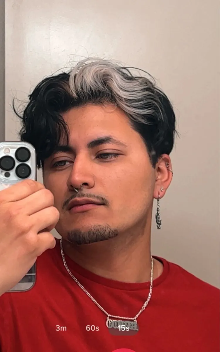 black men's short wavy quiff with silver white ghost roots.