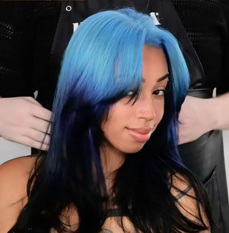 Long black sleek straight hair with aqua blue ghost roots and ombre root placement.
