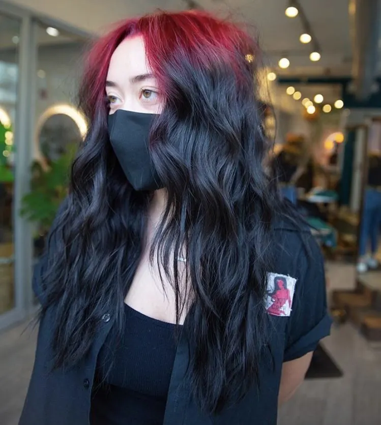 Long black soft waves with burgundy-red ghost roots through the top panel.