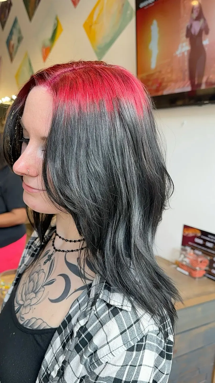 Medium black soft waves with crimson-red ghost roots through a side panel.