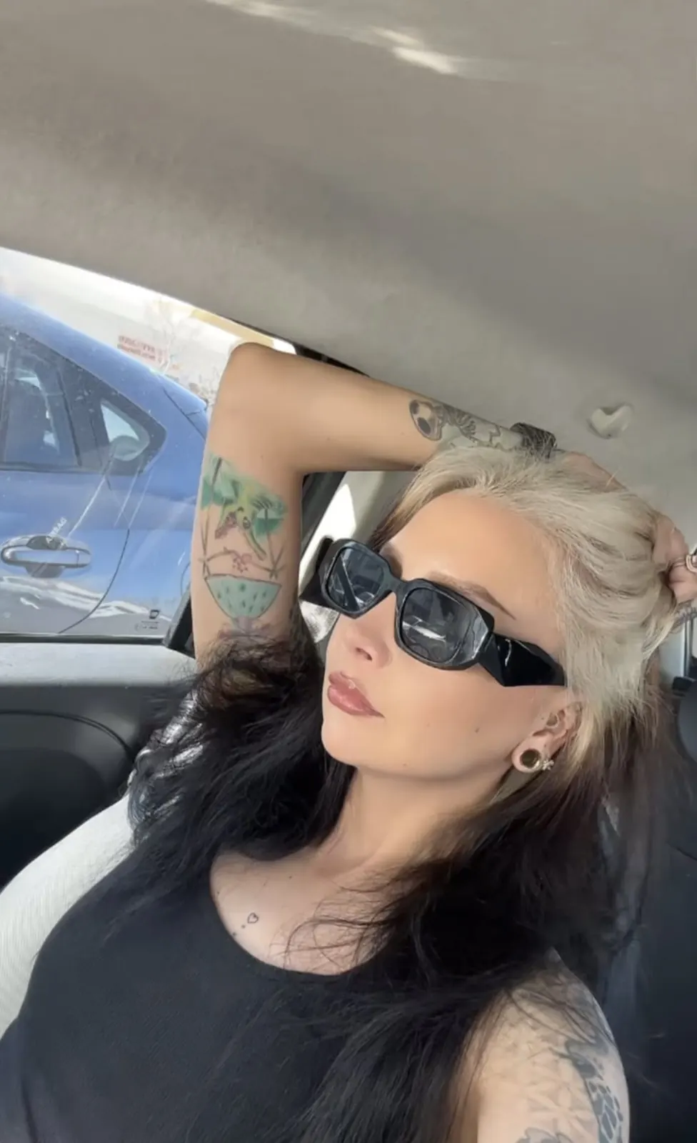 Black hair with Platinum Blonde ghost roots, Medium Soft Wave, Car Selfie.