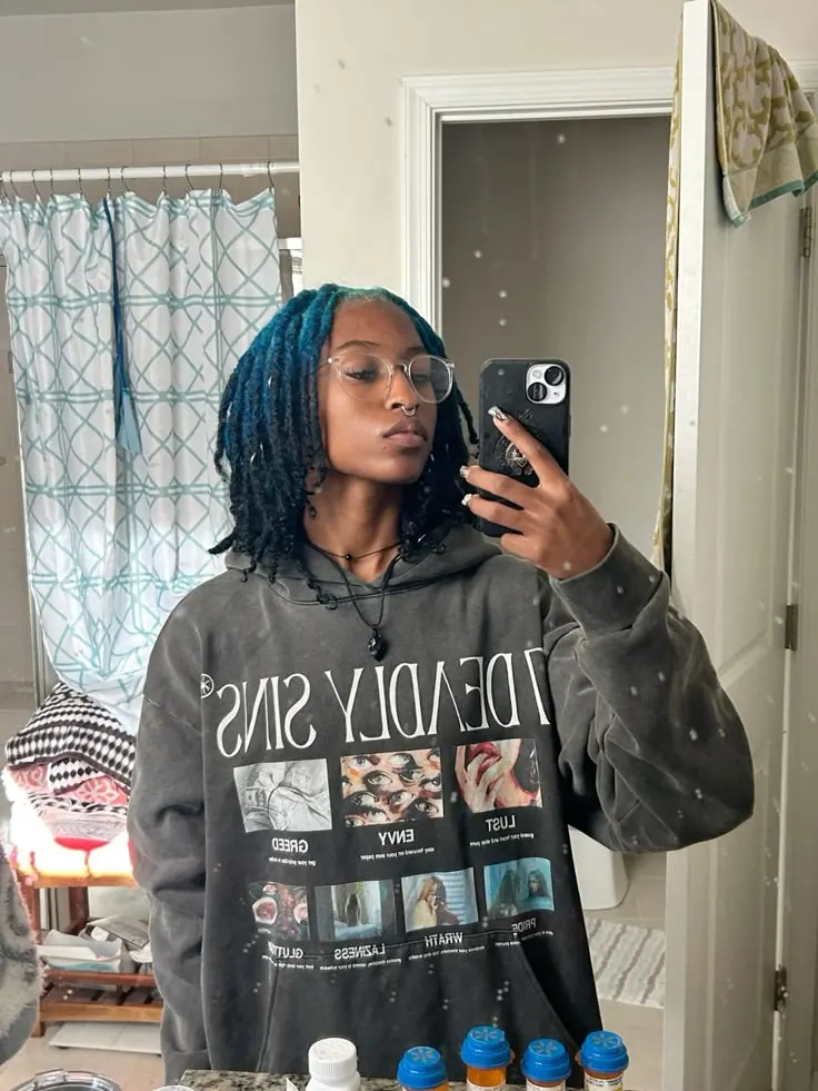 Black hair with Teal Blue ghost roots, Medium Locs, Mirror Selfie.