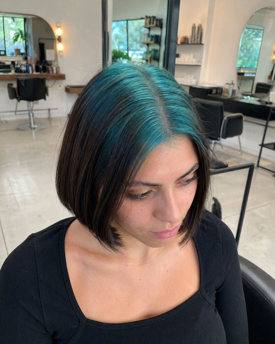 Black hair with Teal Blue ghost roots, Short Sleek Bob, Salon Portrait.