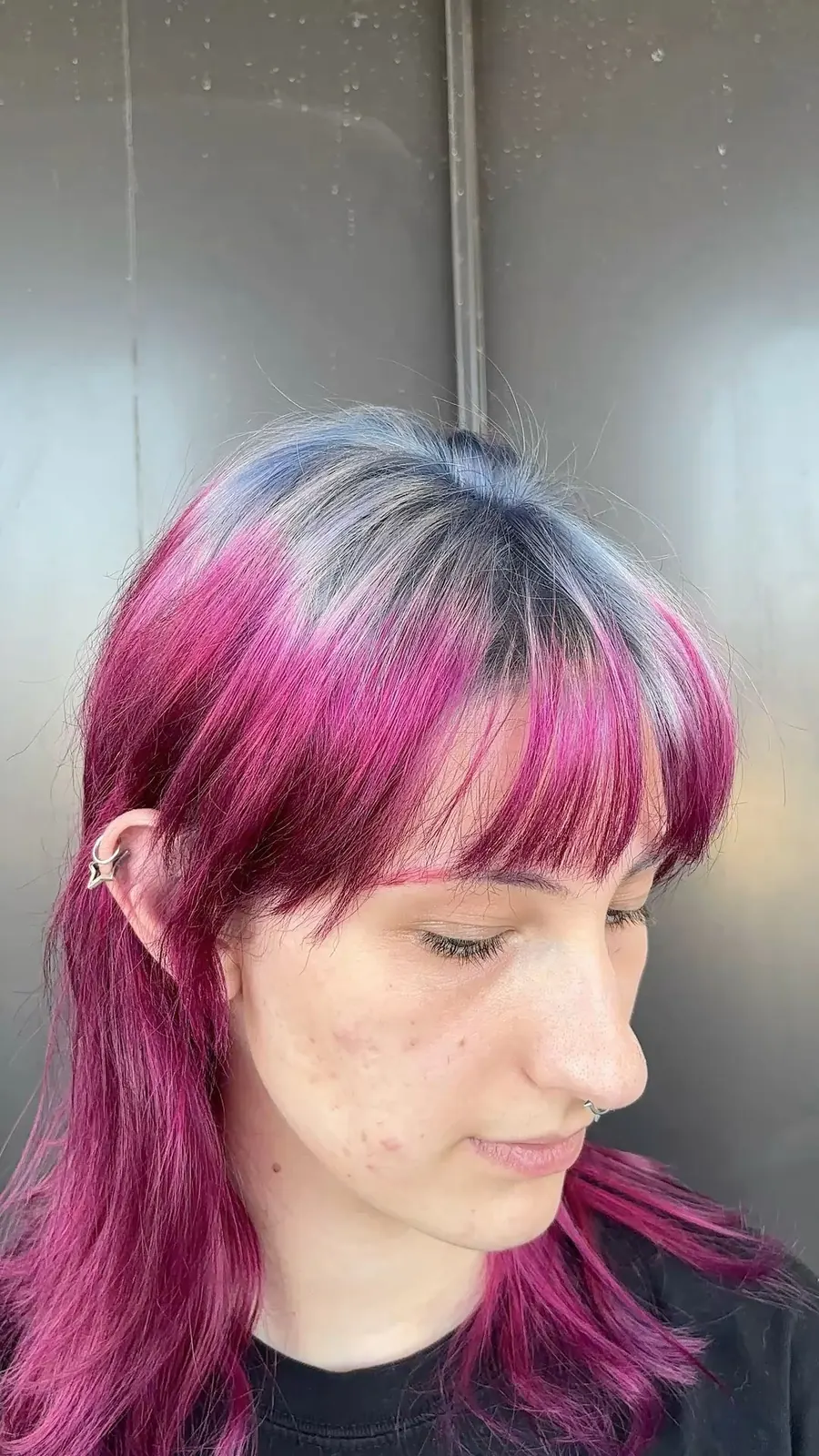 Magenta mullet with smoky silver roots and wispy layered ends.
