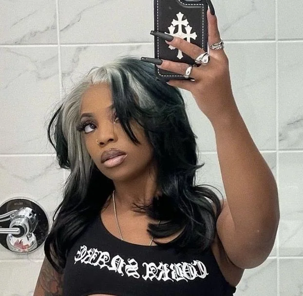 Medium black body waves with silver-white ghost roots in a mirror selfie.
